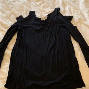Black shirt. Slits down arm.
